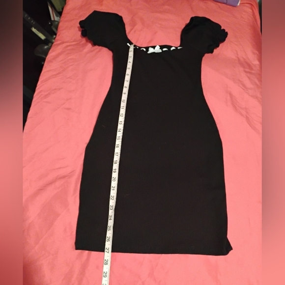 Liz And Sara Elegant Black Mini Dress with White Bow And Stitching Accents. - Picture 10 of 11